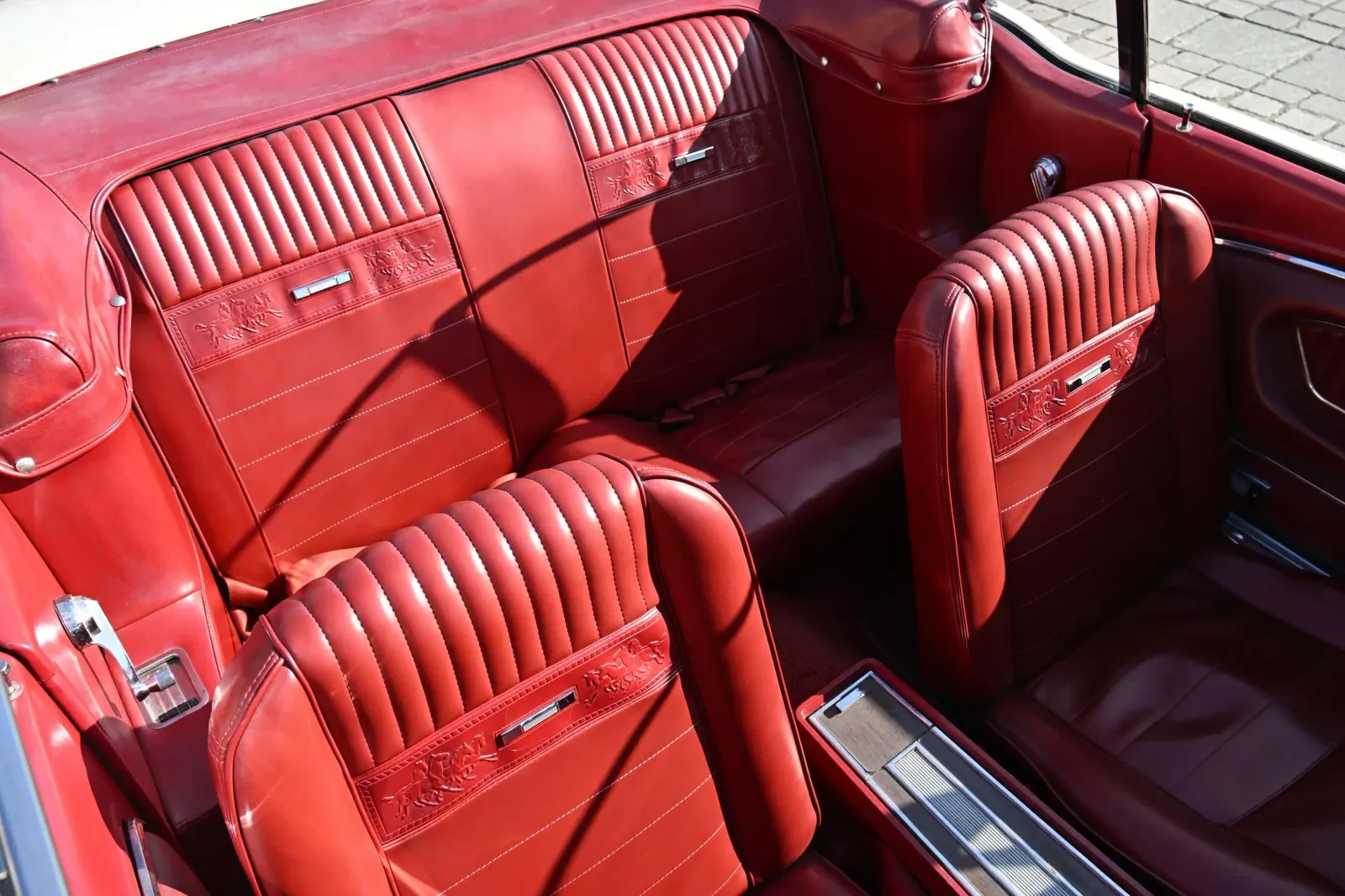 The Mustang’s red Pony seats with embossed horses, stitched panels and chrome details